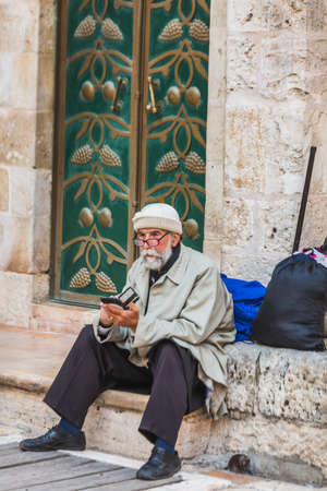 Old man at the church at the Ethiopian section of the Holy Sepulcher in Jerusalem. Jerusalem, Israel - April 19 2018のeditorial素材