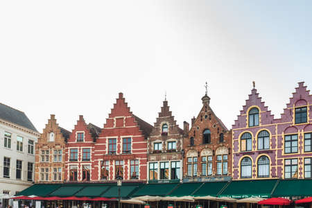 Typical Flemish colored houses on the Grote Markt or Market Square in the center of Bruges, Belgium. Bruges, Belgium - July 28 2018.のeditorial素材
