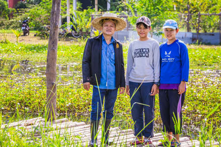 Government representative helps local farmers to develop agricultural farms. Chiang Mai, Thailand - November 12 2017.のeditorial素材
