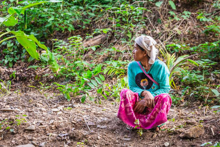 Tribal woman sits in the jungle wearing traditional clothes. Chiang Mai, Thailand - November 12 2017. 2017.のeditorial素材