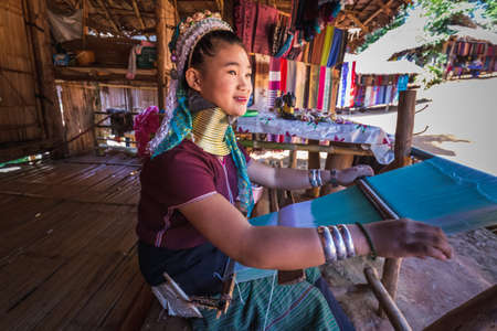 Long-necked Karen woman wearing tribal jewelry and brass rings on the neck. Chiang Rai, Thailand - November 15, 2017.のeditorial素材