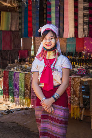 Long-necked Karen woman wearing tribal jewelry and brass rings on the neck. Chiang Rai, Thailand - November 15, 2017.のeditorial素材