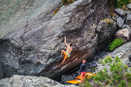 Rock climbing at Hooker Valley track at Mount Cook, New Zealand. Mount Cook, New Zealand - December 24 2017.のeditorial素材