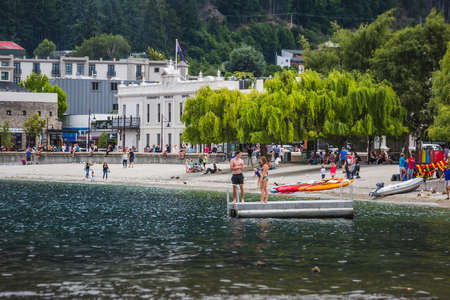 People at the beach of Queenstown New Zealand, South Island. Queenstown, New Zealand - December 17 2017.のeditorial素材
