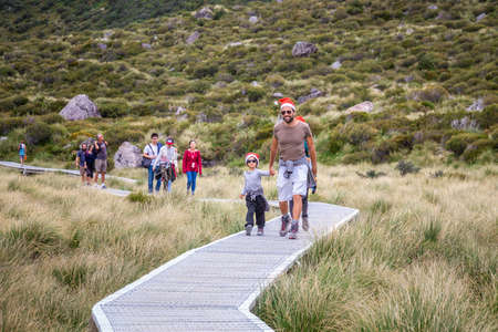 Walking along the great winding Hooker Valley track at Mount Cook, New Zealand. Mount Cook, New Zealand - December 24 2017.のeditorial素材