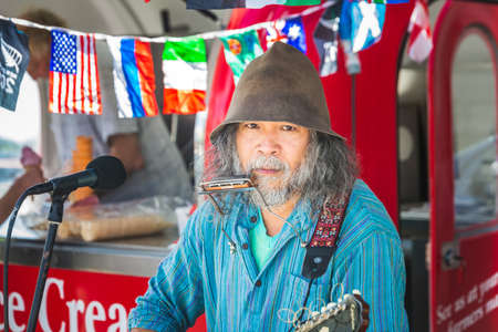 Street musician at the local market. Oamaru, New Zealand - January 07 2018.のeditorial素材