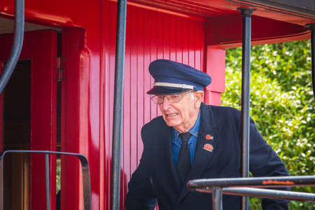 Old train driver at the local market. Oamaru, New Zealand - January 07 2018.のeditorial素材