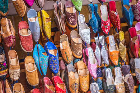 Traditional oriental shoes market stall in Essaouira, Morocco. Essaouira, Morocco - April 14 2016.のeditorial素材