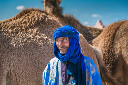 Berber dressed in traditional clothes and turban. Owner of camels at the camel market in Guelmim. Guelmim, Morocco - April 16 2016.のeditorial素材