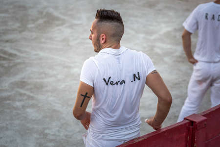 Traditional games in Arles. Men running and fighting against a Camargue-bull in the arena. Arles, France - July 27 2016.のeditorial素材
