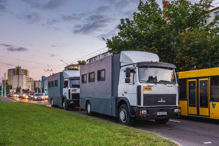 Prisoner transport vehicles waiting for supporters of presidential candidate Svetlana Tikhanovskaya at her campaign rally in Minsk. Minsk, Belarus - July 30 2020.のeditorial素材