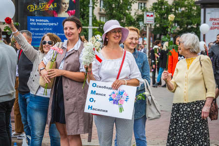 People holding flowers during peaceful protests against stolen presidential elections in Minsk, Belarus. Minsk, Belarus - August 15 2020.のeditorial素材