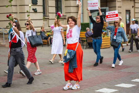 People holding flowers during peaceful protests against stolen presidential elections in Minsk, Belarus. Minsk, Belarus - August 15 2020.のeditorial素材