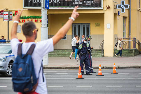 Protesters and police during peaceful protests against stolen presidential elections in Minsk, Belarus. Minsk, Belarus - August 15 2020.のeditorial素材