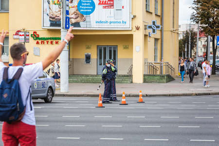 Protesters and police during peaceful protests against stolen presidential elections in Minsk, Belarus. Minsk, Belarus - August 15 2020.のeditorial素材