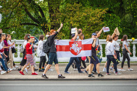 People holding flag during peaceful protests against stolen presidential elections in Minsk, Belarus. Minsk, Belarus - August 15 2020.のeditorial素材