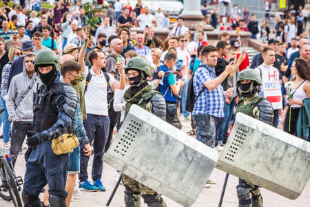 Soldiers and protesters at the main Independence Square near Government House during peaceful protest against rigged elections in Minsk, Belarus. Minsk, Belarus - August 15 2020.のeditorial素材