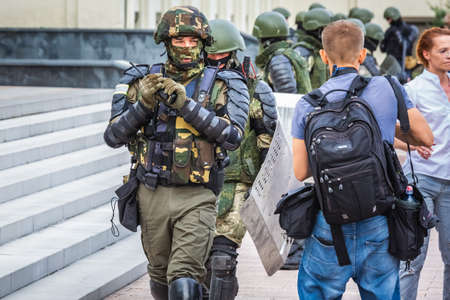 Soldiers and protesters at the main Independence Square near Government House during peaceful protest against rigged elections in Minsk, Belarus. Minsk, Belarus - August 15 2020.のeditorial素材