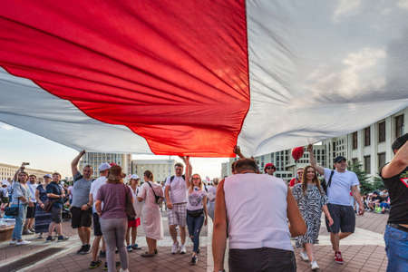 Happy people during biggest peaceful protests in Belarus history against rigged presidential elections in Minsk, Belarus. Minsk, Belarus - August 16 2020.のeditorial素材