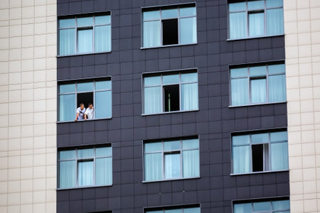 People in the window look at the protests in Belarus. Minsk, Belarus - September 06, 2020.のeditorial素材