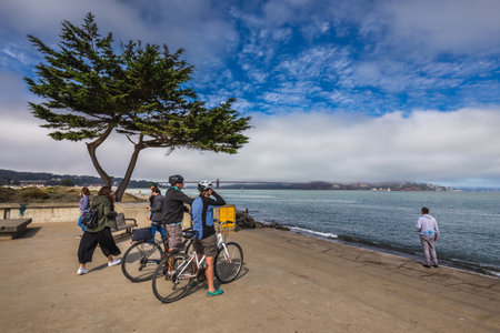 Travel in San Francisco, tourists enjoying the view of Golden Gate Bridge, San Francisco, California, USA. San Francisco, USA - September 14 2018.のeditorial素材