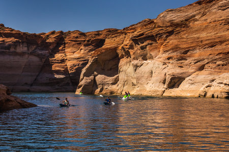 Jet skiing at Lake Powell Lone Rock at Sunset Utah USA. Page, USA - September 21, 2018.のeditorial素材