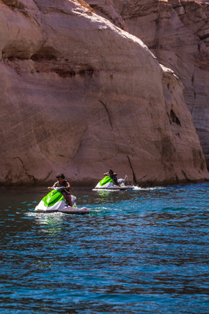 Jet skiing at Lake Powell Lone Rock at Sunset Utah USA. Page, USA - September 21, 2018.のeditorial素材