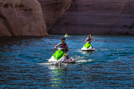 Jet skiing at Lake Powell Lone Rock at Sunset Utah USA. Page, USA - September 21, 2018.のeditorial素材