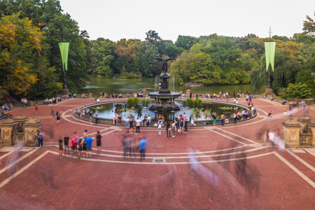 Tourists in Central Park enjoy foliage season. The city attracts 50 million people annually. New York, USA - October 10 2018.のeditorial素材