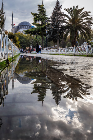 Blue mosque is under a renovation in Istanbul, Turkey. Reflection in the water puddle. Istanbul, Turkey - September 29 2020.のeditorial素材