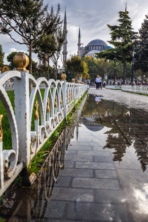 Blue mosque is under a renovation in Istanbul, Turkey. Reflection in the water puddle. Istanbul, Turkey - September 29 2020.のeditorial素材