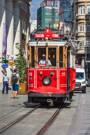 Old red tram on rails at Taksim square. Istanbul, Turkey - September 30 2020.のeditorial素材
