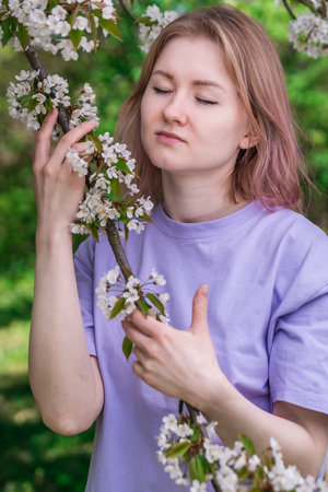 Model in blossoming treesの写真素材