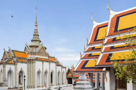 Richly decorated Phra Wiharn Yod with ornate details, on a sunny day against a blue sky, Bangkok,...