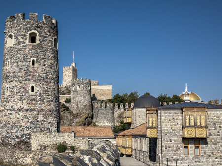 A stunning view of a historic Rabati castle with wooden balconies adorned with intricate carvings, standing against a clear sky.の写真素材