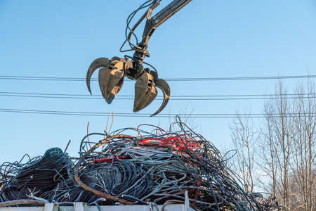 waste of old copper cables in the shell. scrap for non-ferrous metallurgy.の写真素材