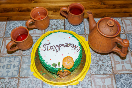 Birthday cake with the inscription I love you and teapotの写真素材