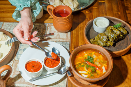 Traditional Georgian dumplings with meat and vegetables on the tableの写真素材