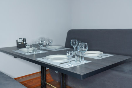 Interior of a modern dining room with a table set for twoの写真素材
