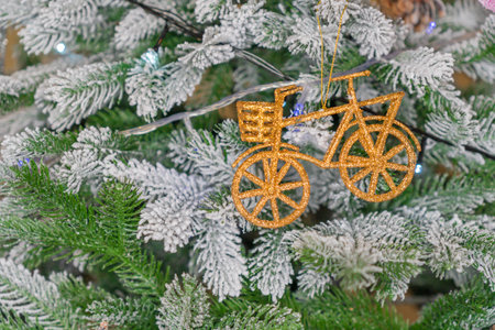 Christmas tree with toys and garlands on the branches of a Christmas treeの写真素材