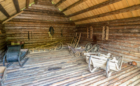 Old wooden cart in a log house, Russia, St. Petersburgの写真素材