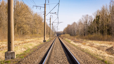 Railroad tracks in the countryside on a sunny day in early springの写真素材