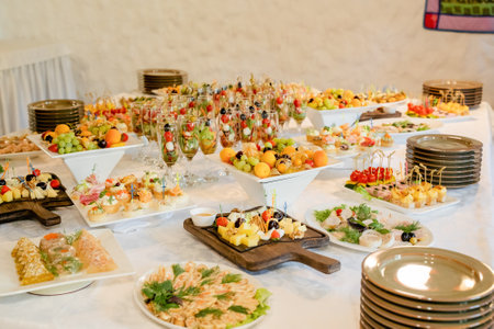 catering buffet with different food snacks and appetizers at restaurant