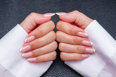 Female hands with pink nail design. Female hands with manicure.の写真素材