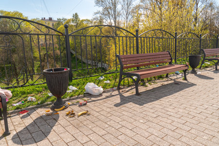 Park bench and trash can in the city center of Kiev, Ukraineの写真素材