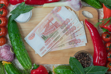 Turkish Lira banknotes, vegetables and spices on a wooden backgroundの写真素材