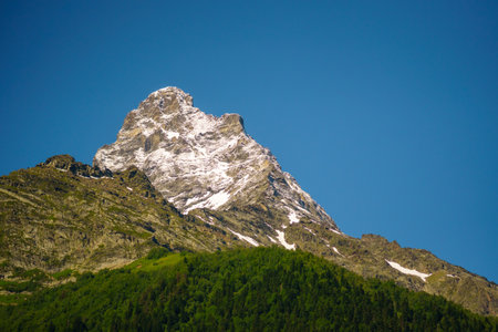 Mountain landscape with snow-capped peaks in the Alps.の写真素材