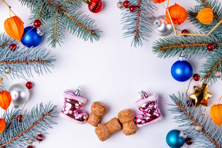 Christmas composition. Christmas toys, cones, fir branches on white background. Flat lay, top view, copy spaceの写真素材