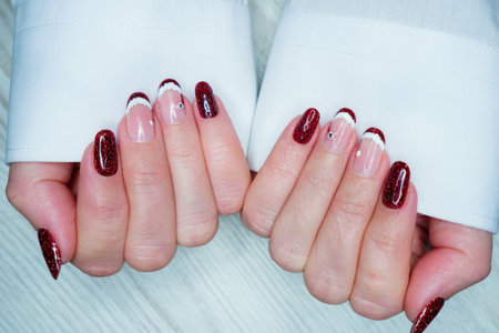Female hands with red nail design. Manicure and manicure.の写真素材