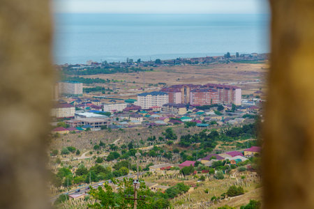 View from the top of the mountain to the city and the sea.の写真素材